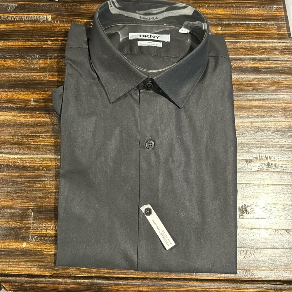 Brand new - still has tags. DKNY men’s slim fit natural stretch dress shirt